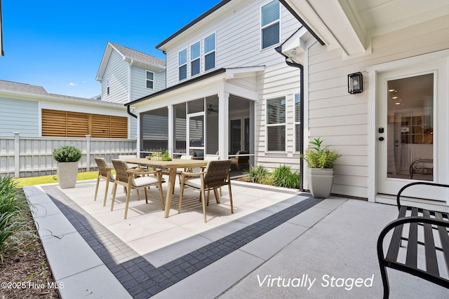 3836 Mason Port Dr, Wilmington, NC 28409 - view of patio / terrace featuring outdoor dining space, a sunroom, and a ceiling fan