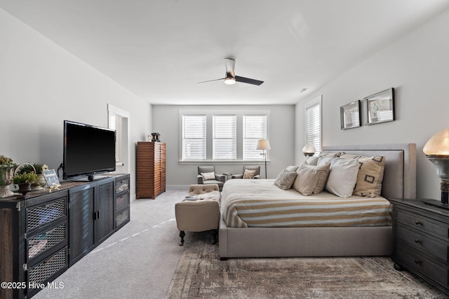 bedroom featuring ceiling fan and carpet