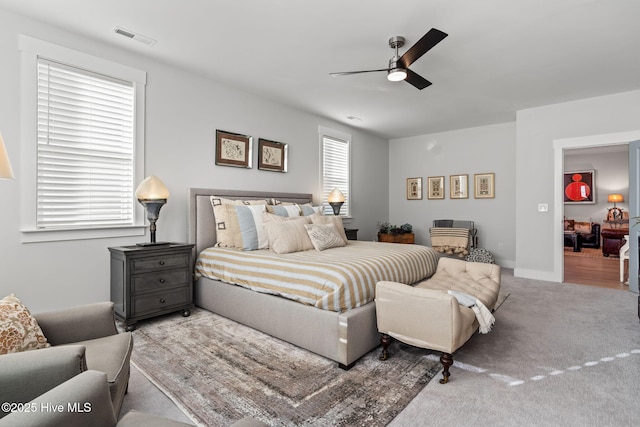 carpeted bedroom featuring ceiling fan