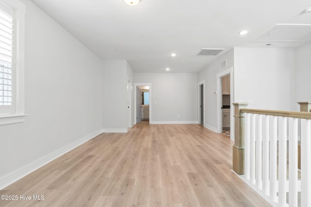 3836 Mason Port Dr, Wilmington, NC 28409 - unfurnished room with light wood-style flooring, attic access, and recessed lighting