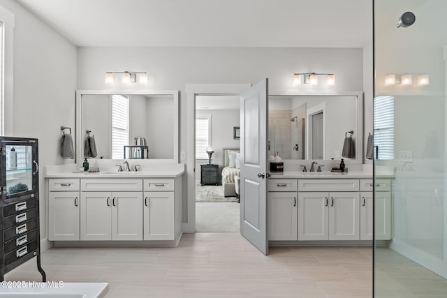 bathroom featuring vanity and a shower