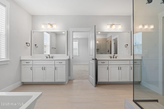 3836 Mason Port Dr, Wilmington, NC 28409 - full bath featuring two vanities, a soaking tub, and a shower