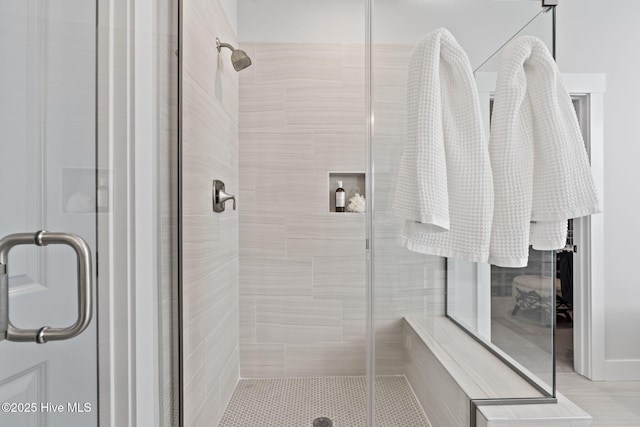 bathroom featuring an enclosed shower