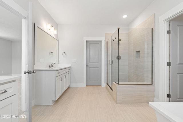 3836 Mason Port Dr, Wilmington, NC 28409 - full bathroom featuring vanity, a shower stall, a soaking tub, and recessed lighting