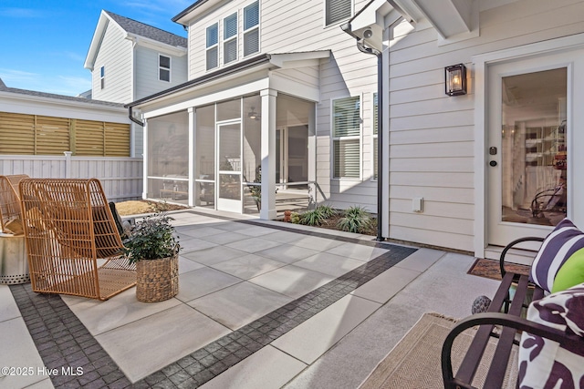 view of patio with a sunroom