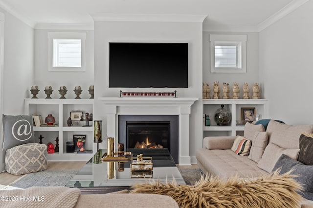 living room with ornamental molding and light wood-type flooring