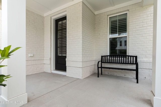 3836 Mason Port Dr, Wilmington, NC 28409 - property entrance featuring a porch and brick siding