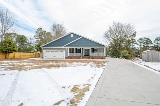 view of front of house with a garage and covered porch