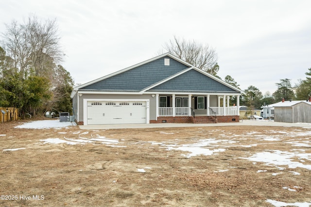 view of front of property with a garage and covered porch