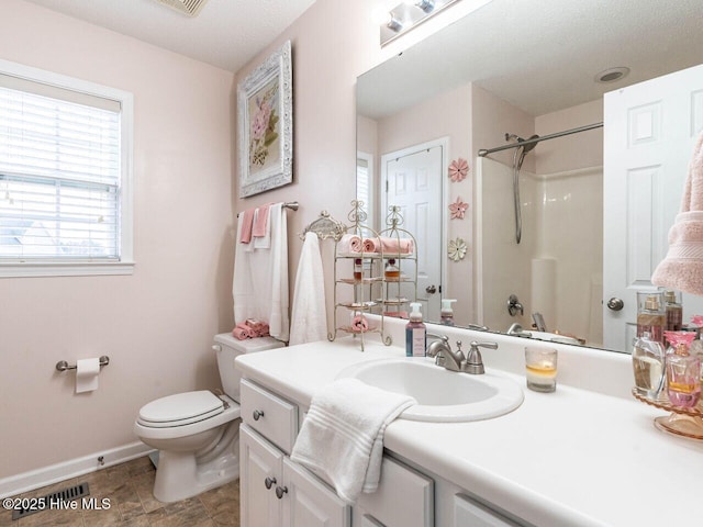 full bathroom with vanity, bathtub / shower combination, and toilet