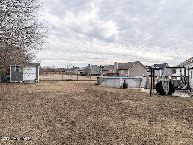 view of yard with a gazebo and a storage unit