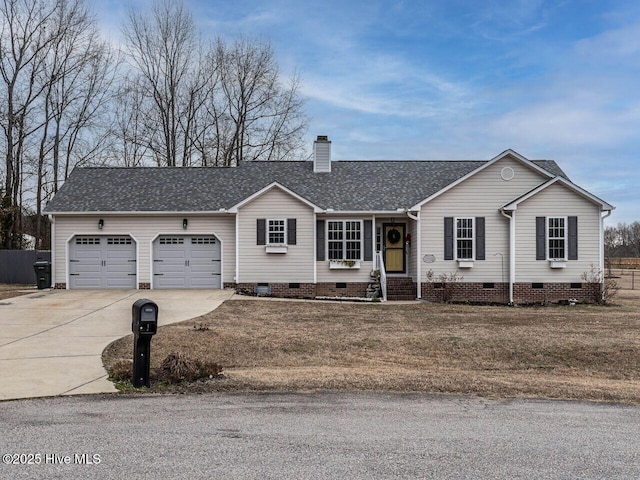 ranch-style house featuring a garage and a front yard