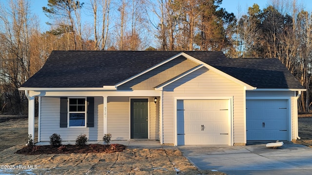 view of front of property featuring a garage and covered porch