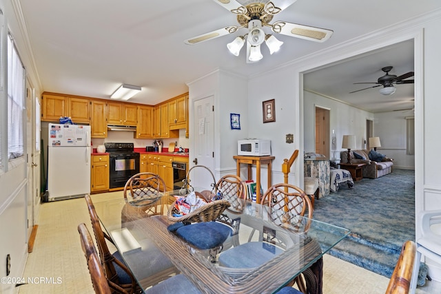 dining space featuring ornamental molding and ceiling fan