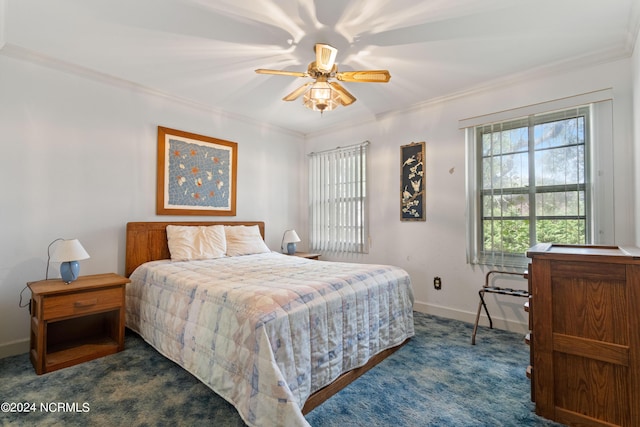 bedroom with crown molding, ceiling fan, and dark colored carpet