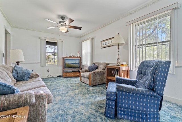 carpeted living room featuring crown molding and ceiling fan