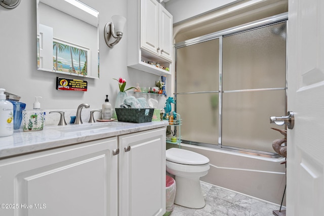 full bathroom with vanity, toilet, and combined bath / shower with glass door