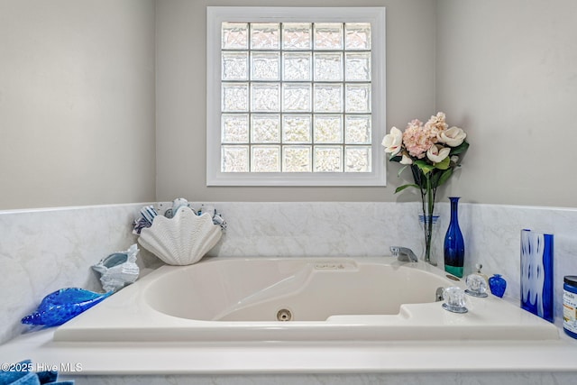 bathroom featuring a bath