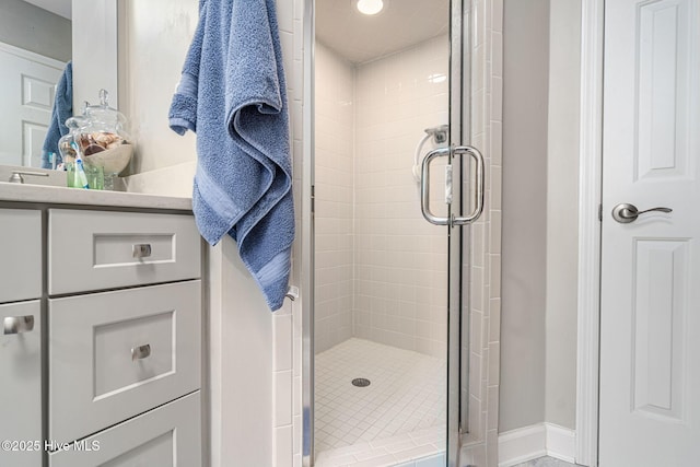 bathroom with a shower with shower door