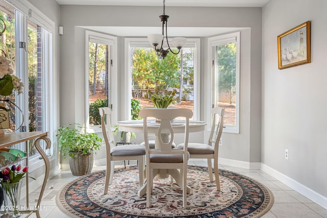 sunroom with an inviting chandelier