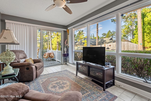 sunroom with ceiling fan and plenty of natural light