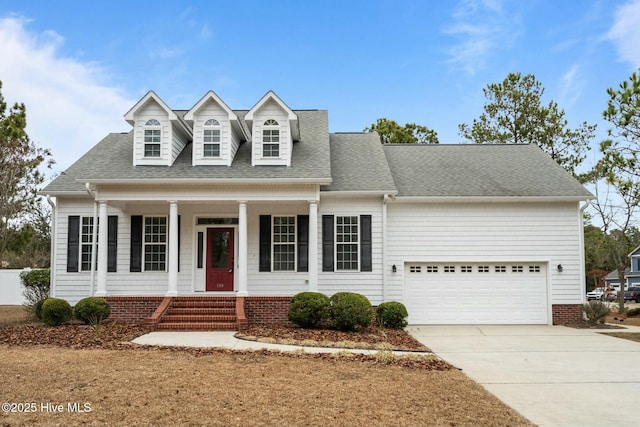 cape cod home with a garage