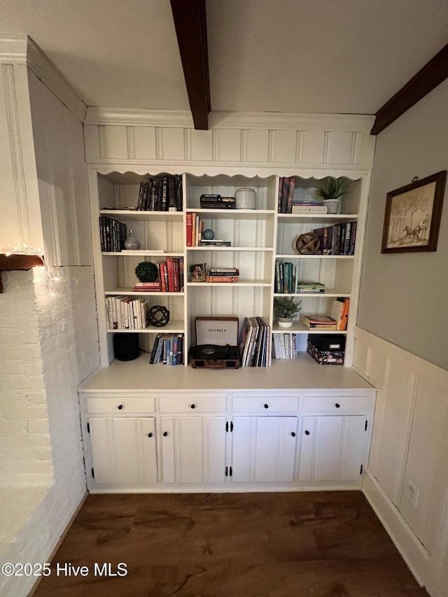 room details with beamed ceiling and hardwood / wood-style floors