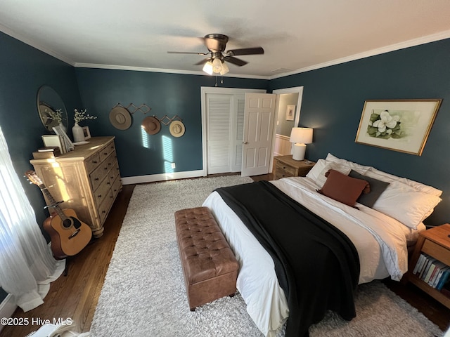 bedroom with crown molding, ceiling fan, and hardwood / wood-style flooring