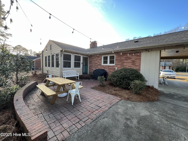 rear view of property with a patio