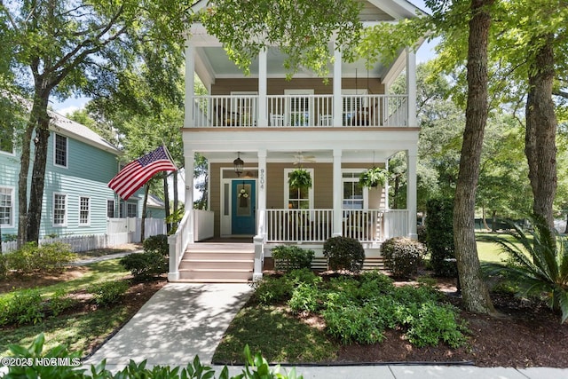 view of front of house with a balcony and covered porch