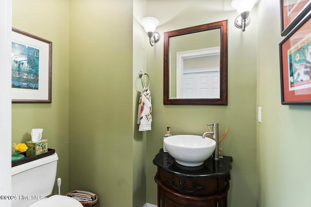 bathroom featuring vanity and toilet