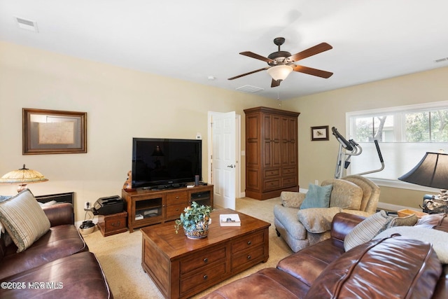 living room with light colored carpet and ceiling fan