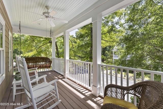 wooden deck with ceiling fan and covered porch