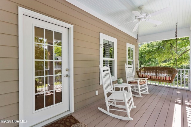 deck featuring ceiling fan and a porch