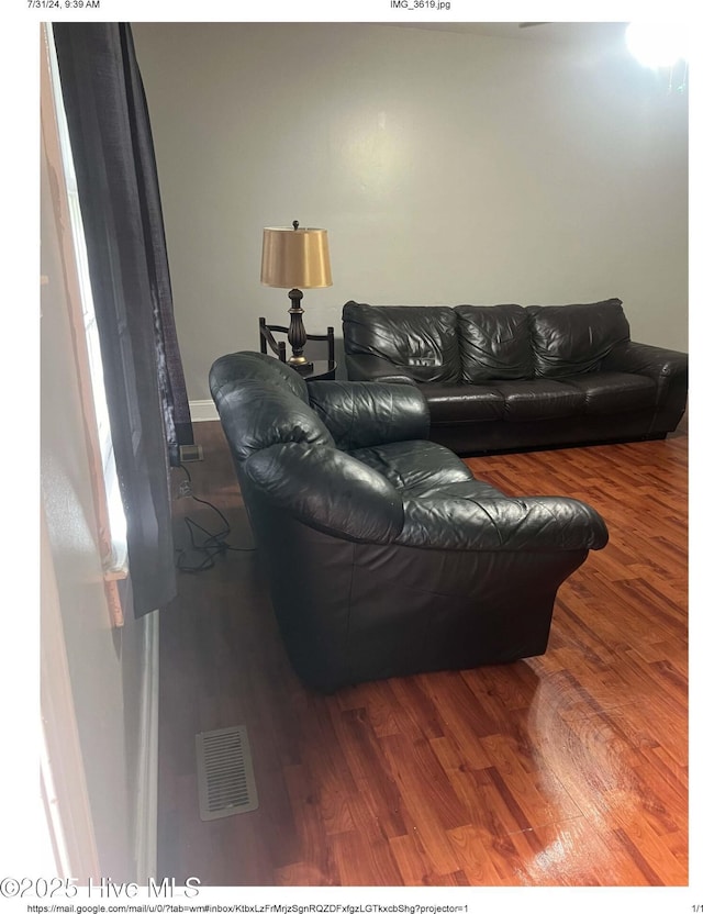 living room featuring dark hardwood / wood-style floors