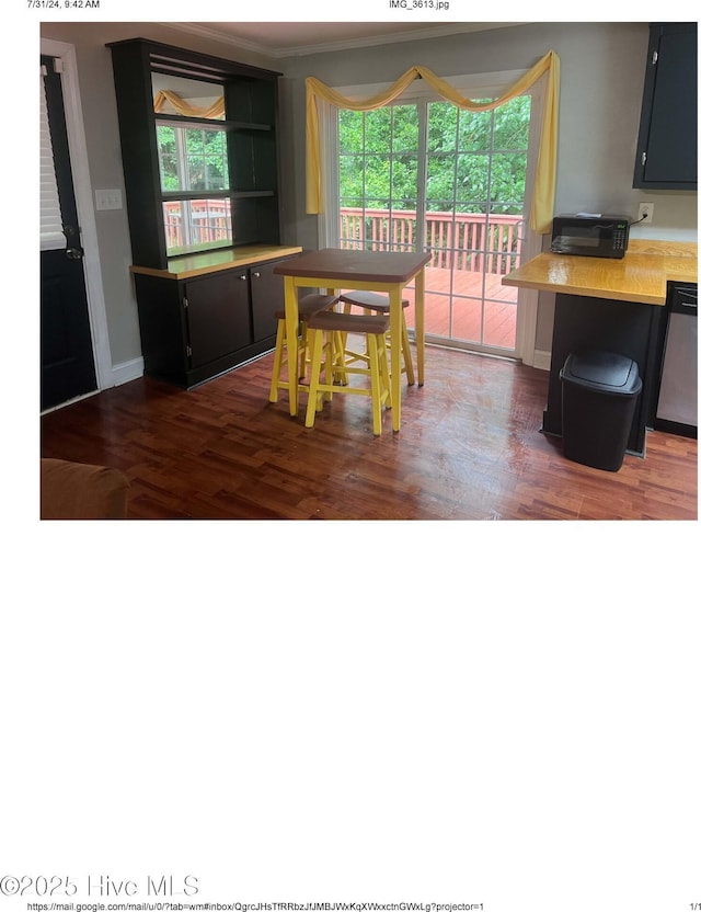 dining space featuring dark hardwood / wood-style floors