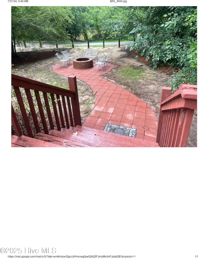 view of patio with an outdoor fire pit