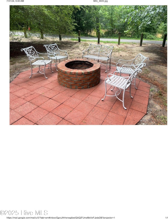 view of patio featuring a fire pit