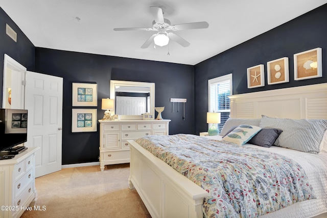 bedroom featuring light colored carpet and ceiling fan