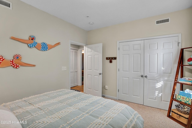 bedroom featuring a closet and light carpet