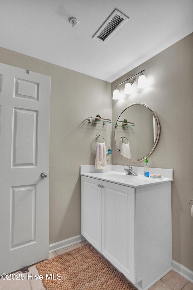 bathroom featuring tile patterned flooring and vanity