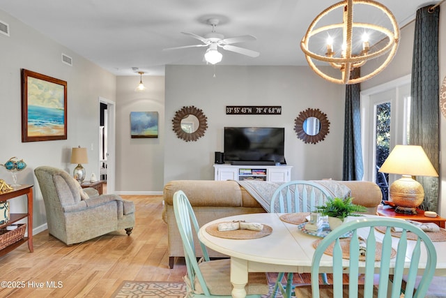 dining room with a notable chandelier and light hardwood / wood-style flooring