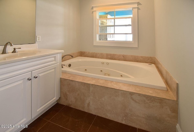 bathroom with vanity, tiled tub, and tile patterned floors