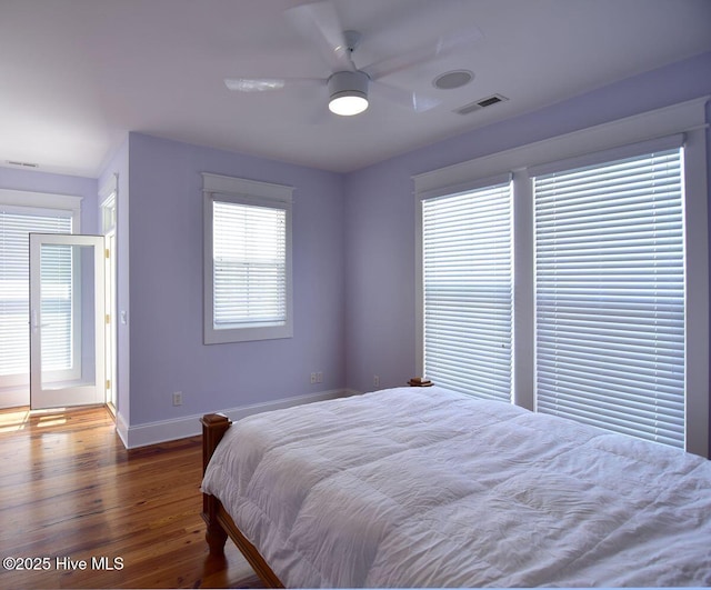 bedroom with dark wood-type flooring and ceiling fan