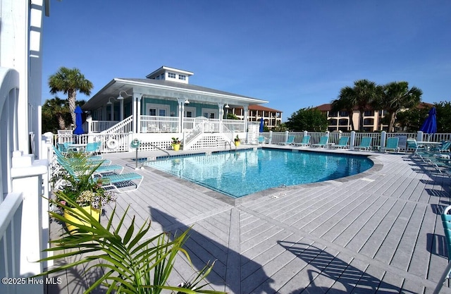 view of swimming pool with a patio area