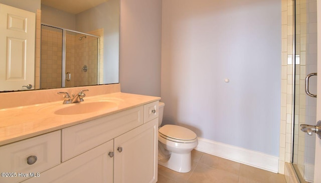 bathroom featuring walk in shower, tile patterned floors, toilet, and vanity