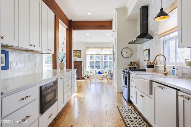 kitchen with tasteful backsplash, double oven range, wall chimney range hood, and built in microwave