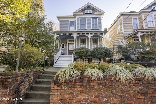 view of front facade with covered porch and stairs