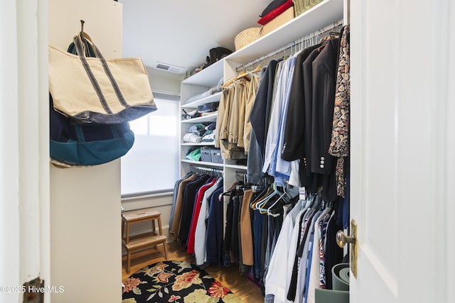 walk in closet featuring dark hardwood / wood-style floors