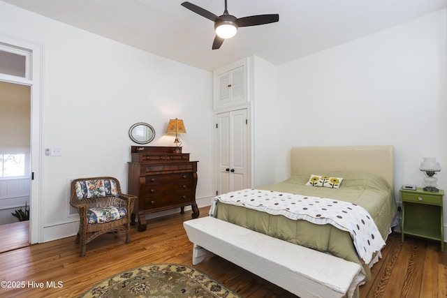 bedroom featuring wood finished floors and a ceiling fan